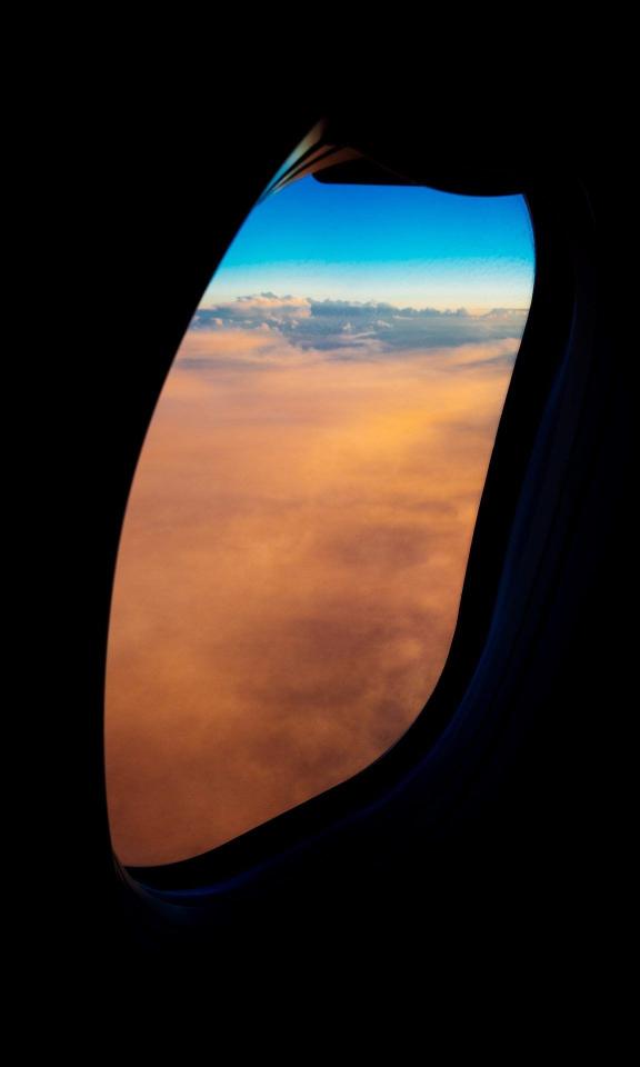 Airplane Window Sunset View