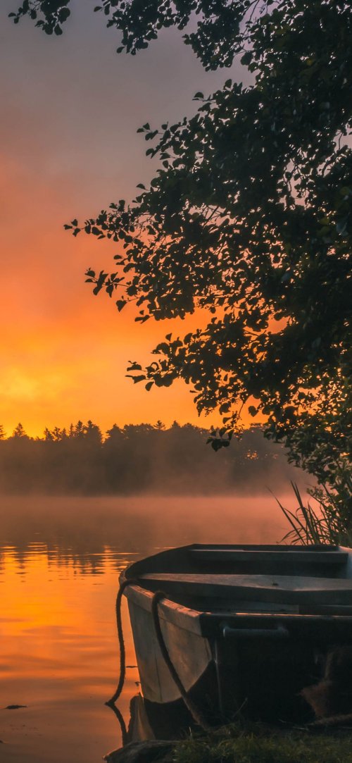 Misty Sunrise Boat Scene