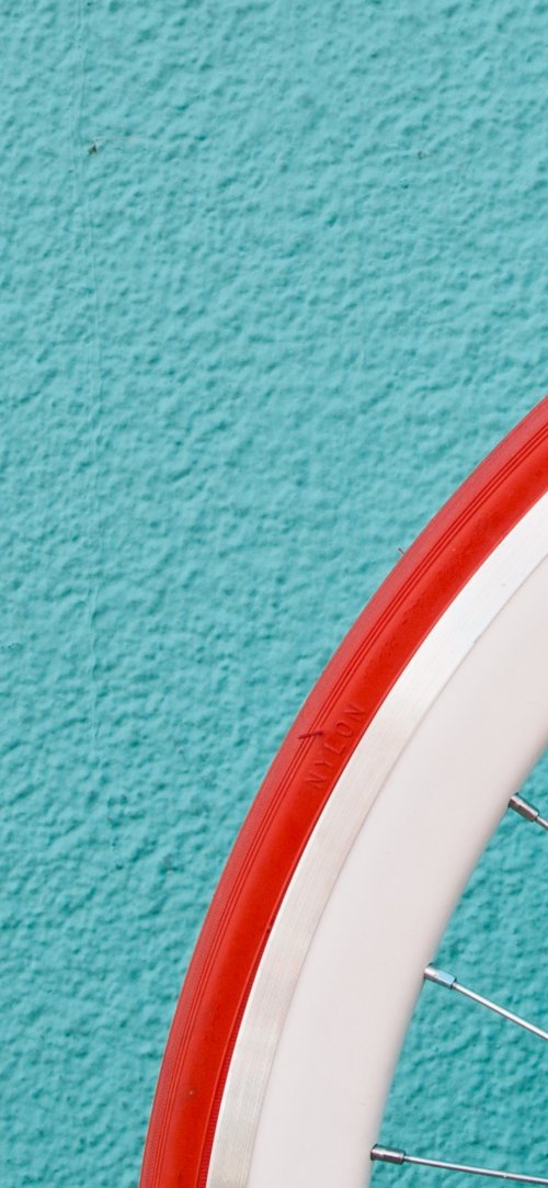 Red Tire on Teal - Related StockWalls wallpaper