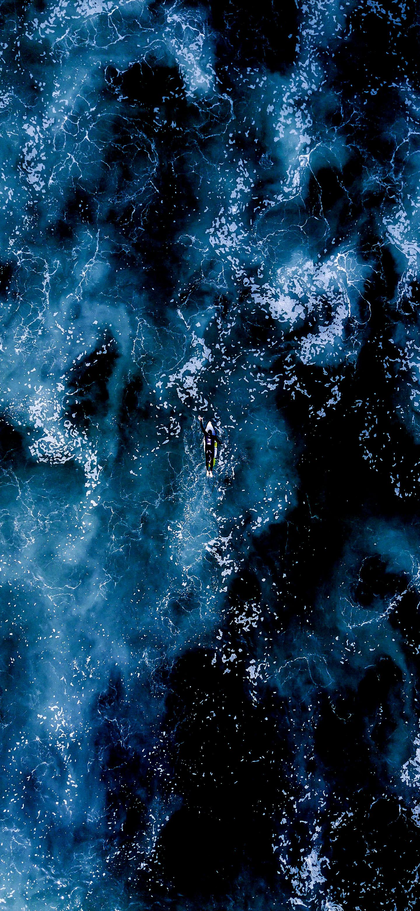 Surfer in Dark Ocean - random wallpaper for OpersCraft