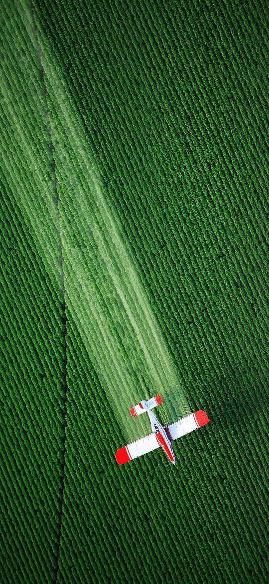 Crop Duster Over Green Field