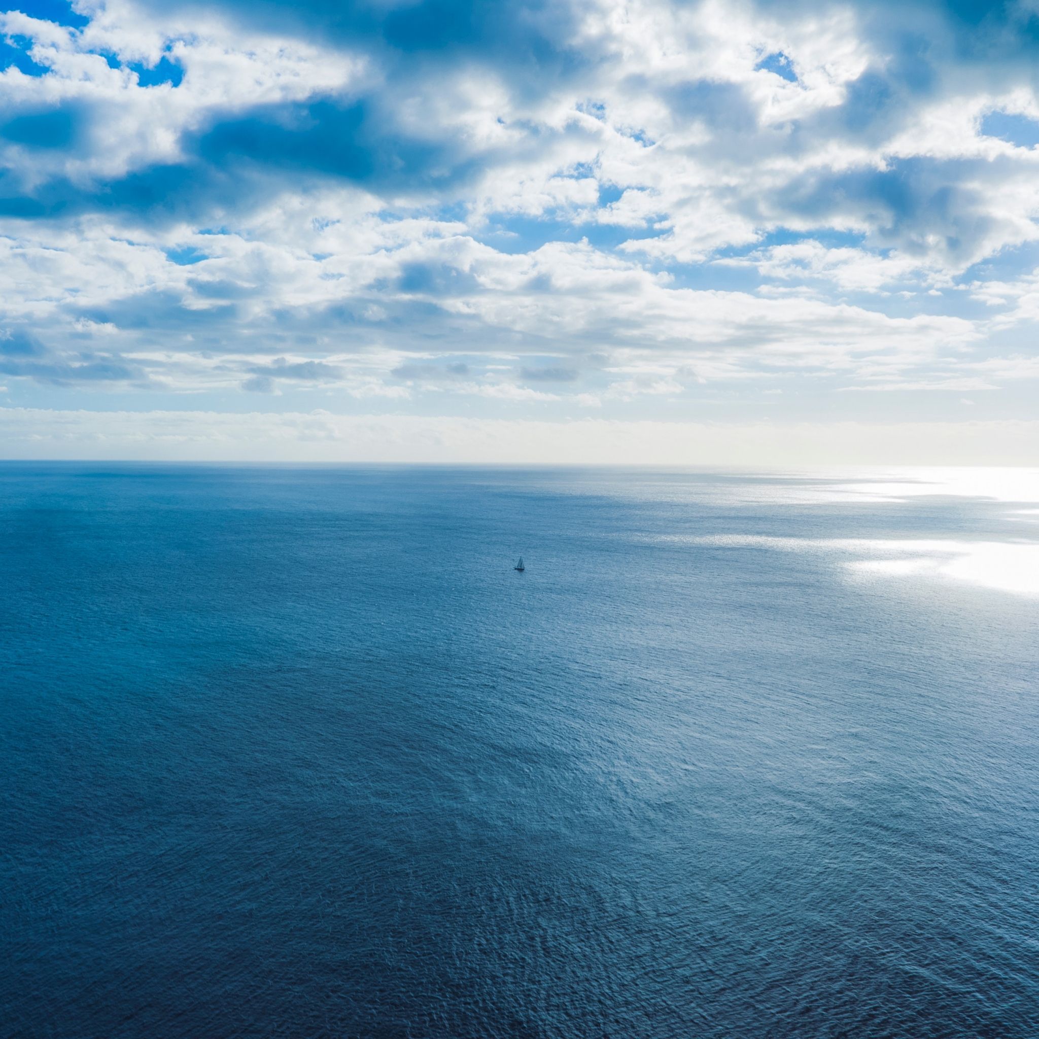 Sailboat on Open Ocean - apple wallpaper for StockWalls